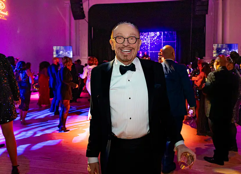 man in tuxedo smiling