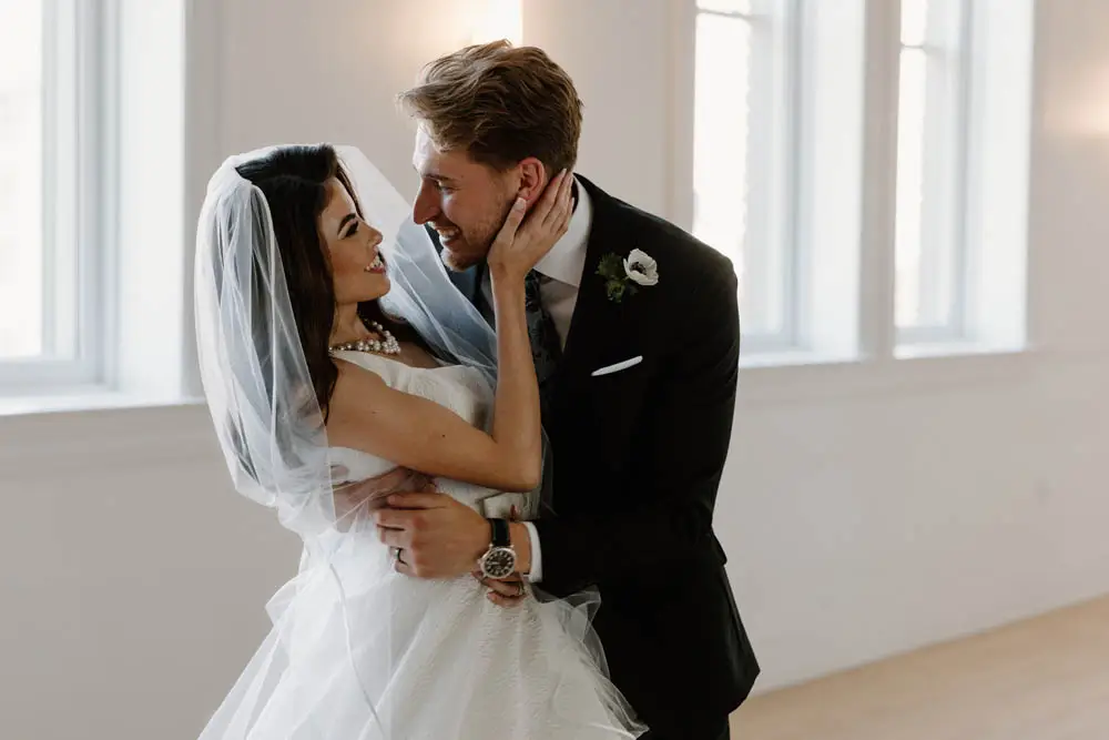 bride and groom hold eachother