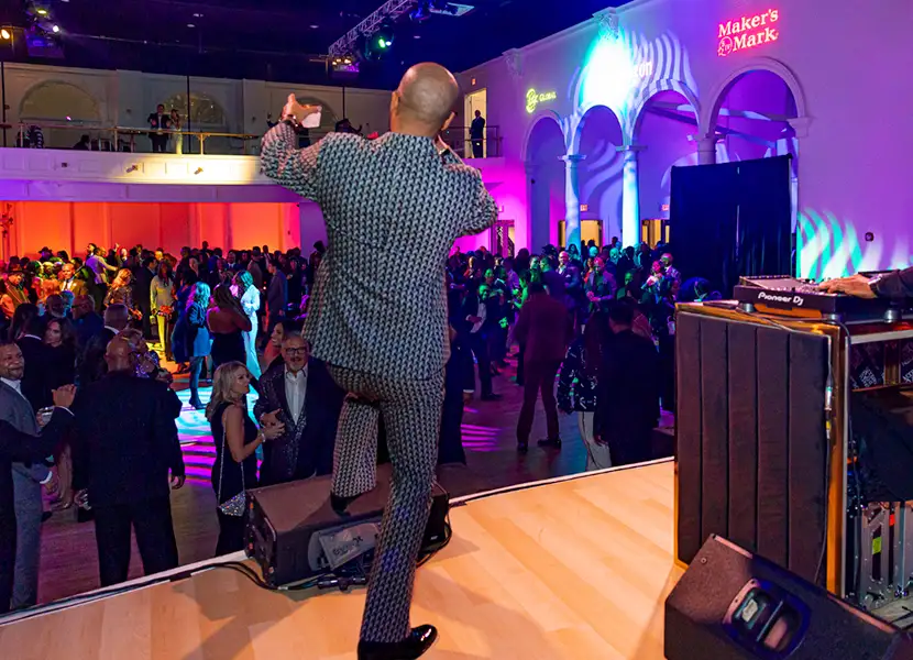 Man talking to audience with a microphone