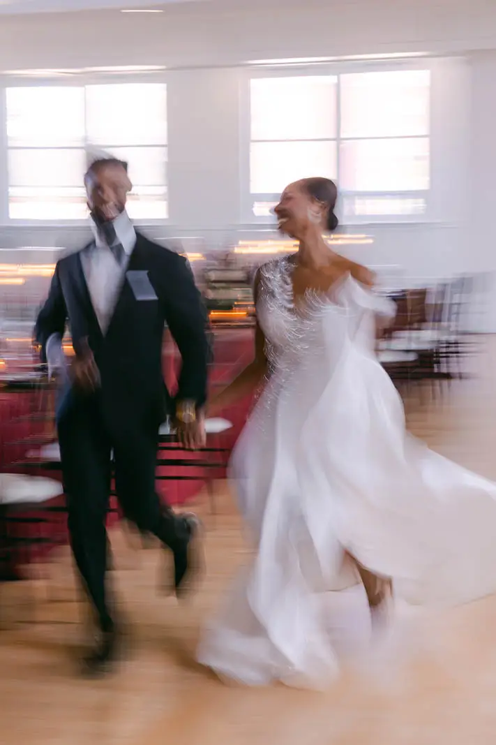 groom and bride running